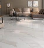 Amalfi marble-look porcelain floor in a living room with a sectional sofa