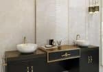 Fama onyx-look porcelain above a black vanity with brass fittings
