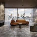 Grey Volcano marble-look porcelain floor in a lounge with an ocean view