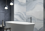 Ore Blue agate-look porcelain behind a freestanding bath and pendants