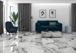 Polar Blanco marble-look porcelain floor in a living room with a teal sofa